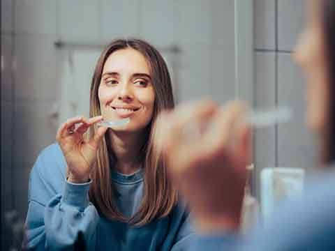 Patient in Downers Grove smiling with their Invisalign aligner