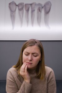 Woman in pain at an emergency dentist