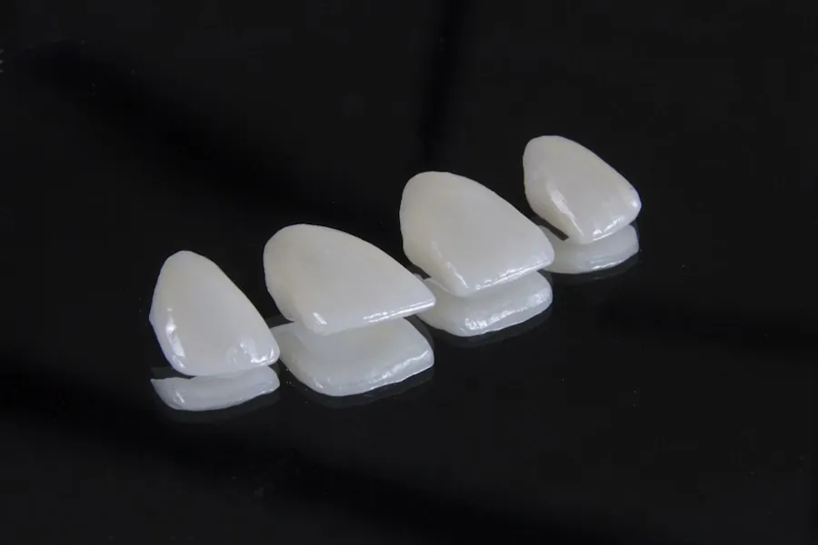 Ceramic dental crowns and veneers on a dark surface
