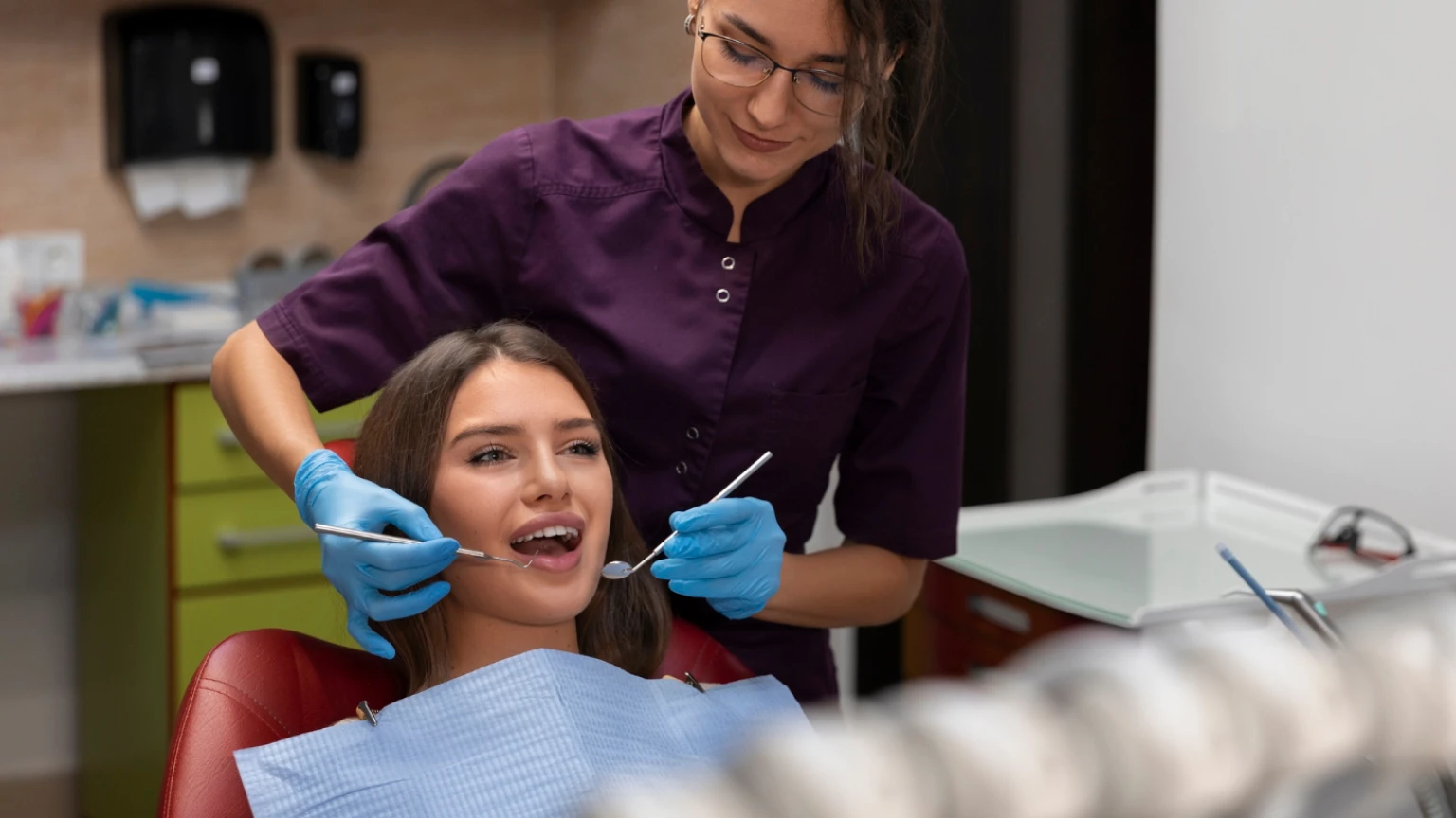 Smiling patient after All-on-4 dental implants full mouth restoration at Dentique Dental Care